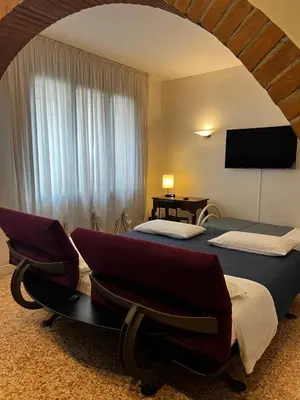 Letto o letti in una camera di Locazione Turistica Joyful Padova
