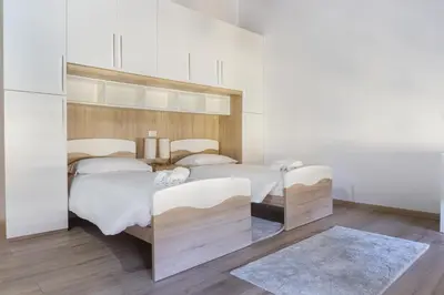 Letto o letti in una camera di Casa Vittoria