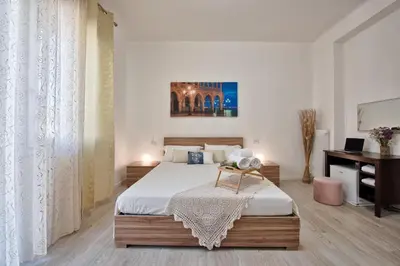 Letto o letti in una camera di La Venezia Station Residence Mestre