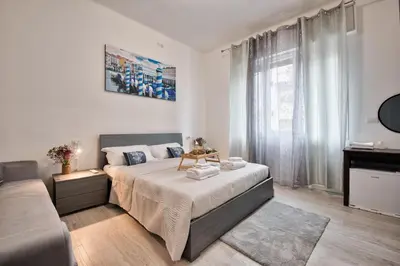 Letto o letti in una camera di La Venezia Station Residence Mestre