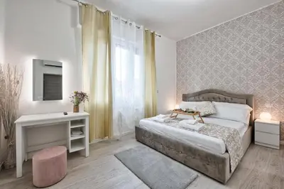 Letto o letti in una camera di La Venezia Station Residence Mestre