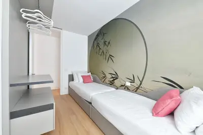 Letto o letti in una camera di The Summer Houses Apartment