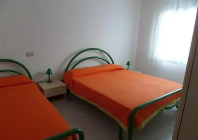Letto o letti in una camera di Cozy apartment in Rosolina