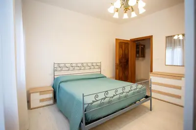 Letto o letti in una camera di Dimora Giannino e Mirella Isola di Pellestrina Ve