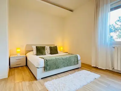 Letto o letti in una camera di Cozy Apartment 10 min to Venice by Tram & Free Parking