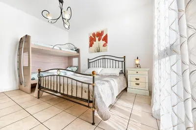 Letto o letti in una camera di Jesolo Flowers Beach House - Host Solution