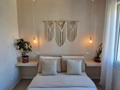 Letto o letti in una camera di Stazione Rooms