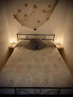 Letto o letti in una camera di Casa Gioia