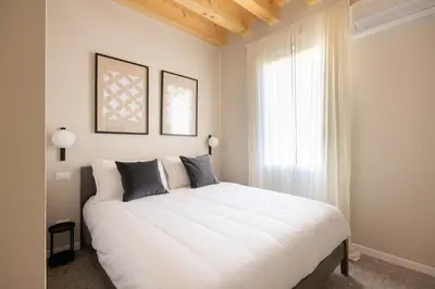 Letto o letti in una camera di PALAZZO CIVIDALE Central Luxury Apartment B