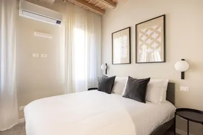 Letto o letti in una camera di PALAZZO CIVIDALE Central Luxury Apartment A