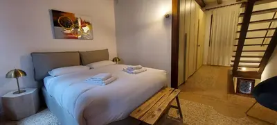 Letto o letti in una camera di Domus Estia