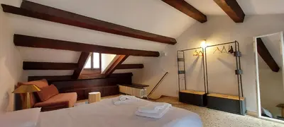 Letto o letti in una camera di Domus Estia