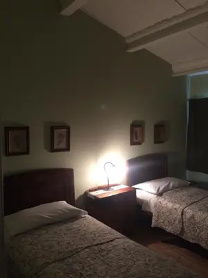 Letto o letti in una camera di Corte San Giuliano