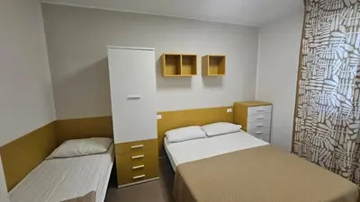 Letto o letti in una camera di Villa Veranda Quadrilocale