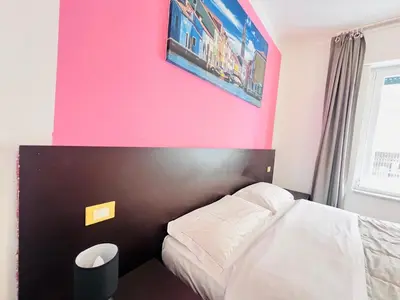 Letto o letti in una camera di L'affitta Camere di Venezia