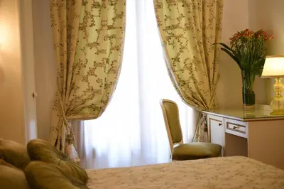 Letto o letti in una camera di Casa Savoia & Casa Jolanda