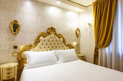 Letto o letti in una camera di Casa Savoia & Casa Jolanda