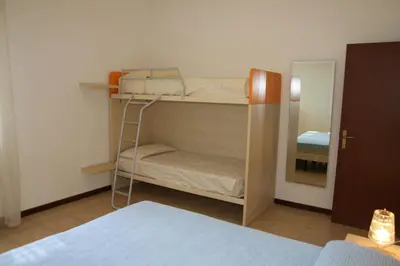 Letto o letti in una camera di Jolly family apartments