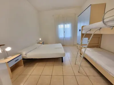 Letto o letti in una camera di Jolly family apartments