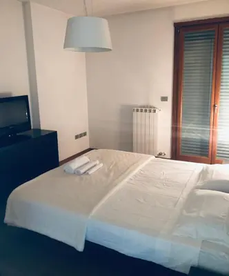 Letto o letti in una camera di Camera privata con bagno su appartamento condiviso