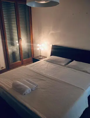 Letto o letti in una camera di Camera privata con bagno su appartamento condiviso