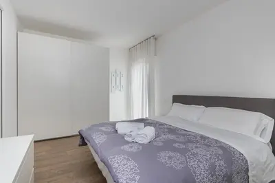 Letto o letti in una camera di GuestHost - Charming Apartment in Venezia Mestre