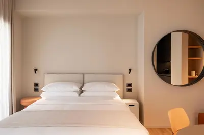 Letto o letti in una camera di Alma Suites