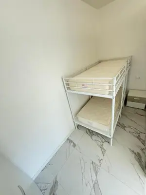 Letto o letti in una camera di WHITE APARTMENTS - Solo per famiglie- WALTERIGATO APARTMENTS