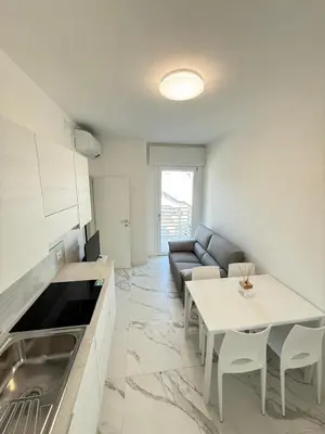 Cucina o angolo cottura di WHITE APARTMENTS - Solo per famiglie- WALTERIGATO APARTMENTS