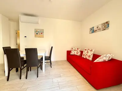 Area soggiorno di Enia - Carraro Immobiliare - Family Apartments