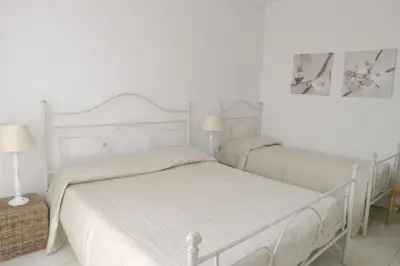 Letto o letti in una camera di Borgo dei Fiori Apartments