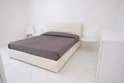 Letto o letti in una camera di Cansiglio Apartments