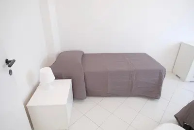 Letto o letti in una camera di Cansiglio Apartments