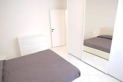 Letto o letti in una camera di Cansiglio Apartments
