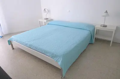 Letto o letti in una camera di Centro Commerciale Apartments