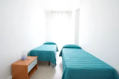 Letto o letti in una camera di Centro Commerciale Apartments