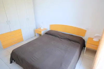 Letto o letti in una camera di Marina Village Apartments
