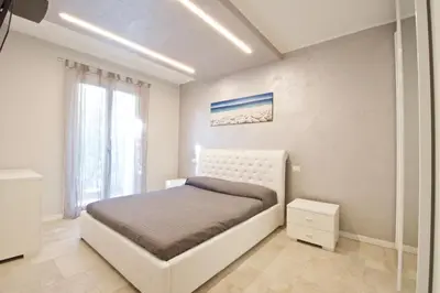 Letto o letti in una camera di Le Residenze Mediterranee Apartments
