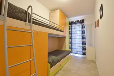 Letto o letti in una camera di Le Residenze Mediterranee Apartments