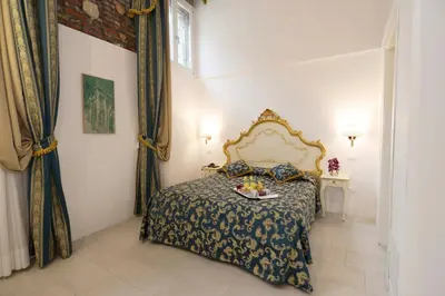 Letto o letti in una camera di Al Mascaron Ridente