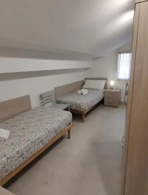 Letto o letti in una camera di Novella Apartment