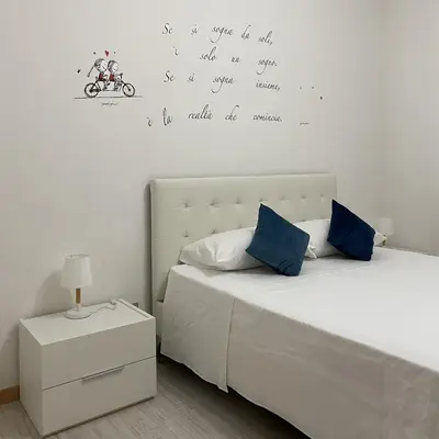 Letto o letti in una camera di [Piazza_Drago_Apartment] Pool, Garden & Free Park