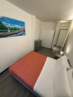 Letto o letti in una camera di AHF apartments