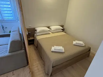 Letto o letti in una camera di Campari Home - 15 min da Venezia - Tram diretto