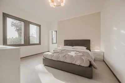 Letto o letti in una camera di Dauli Suite - tra Venezia e Padova & Parcheggio