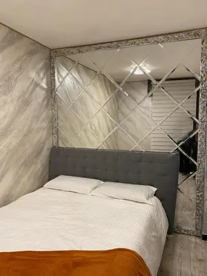 Letto o letti in una camera di Appartamento SOLO 1 camera da letto soggiorno con angolo cottura completo e bagno Tutto ad uso esclusivo max 2 persone