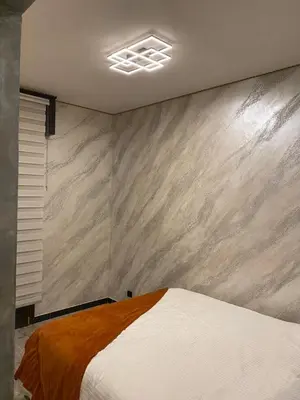 Letto o letti in una camera di Appartamento SOLO 1 camera da letto soggiorno con angolo cottura completo e bagno Tutto ad uso esclusivo max 2 persone