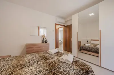 Letto o letti in una camera di Unico Apt 4, 6 ospiti, parcheggio gratis, 10 minuti da Venezia