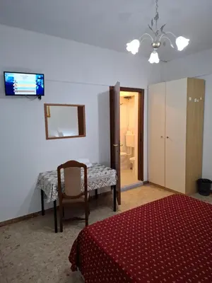 Letto o letti in una camera di LUCAZIONE TURISTICa
