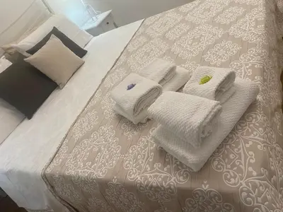 Letto o letti in una camera di Casa AnnaPaola Luxury